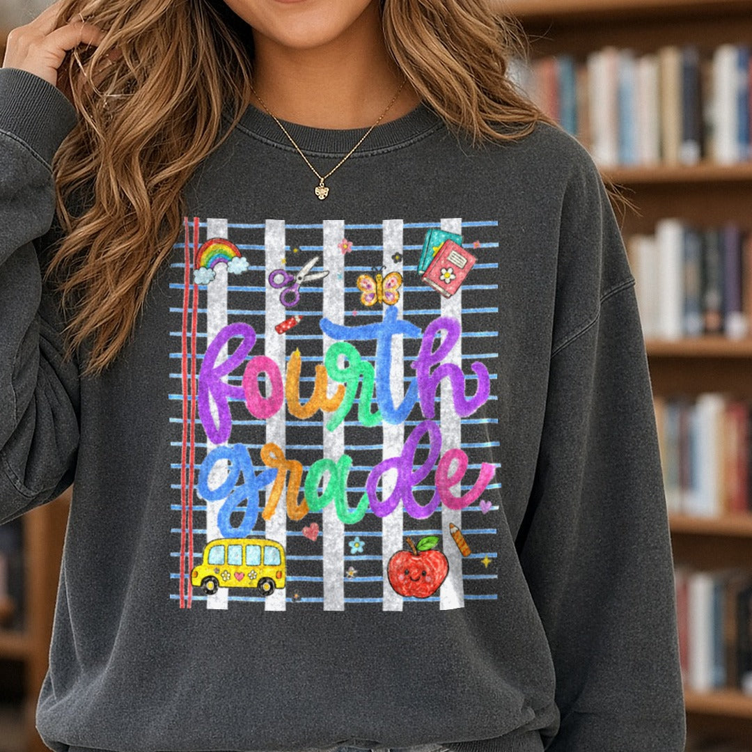 Fourth Grade Rainbow Lettering Back to School Kids Design DTF transfer shown on a Comfort Colors sweatshirt