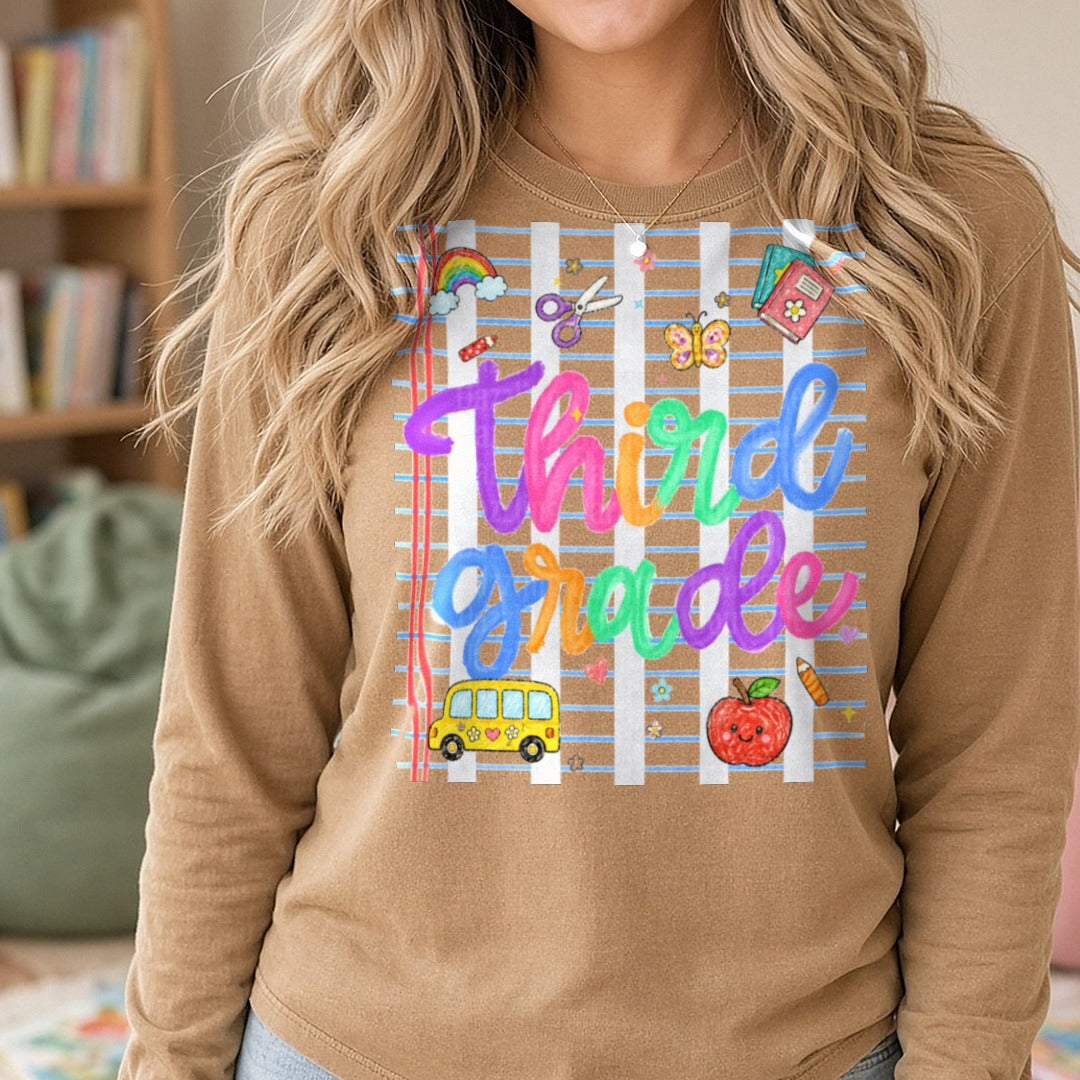 Colorful Third Grade Script with School Doodles DTF transfer shown on a Comfort Colors long sleeve tee