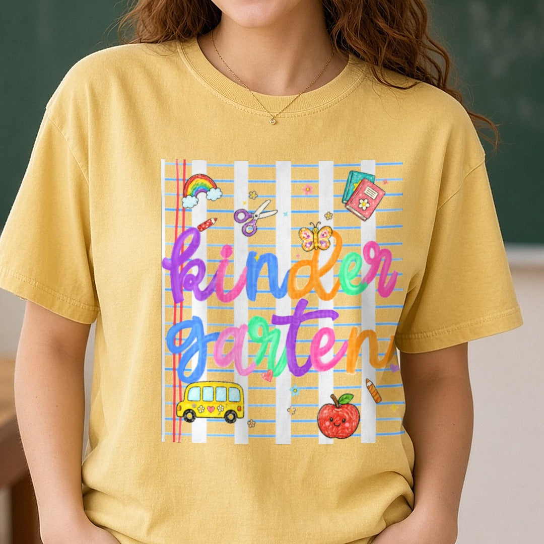 Kindergarten Rainbow School Bus Apple Colorful Lettering DTF transfer shown on a Comfort Colors tee