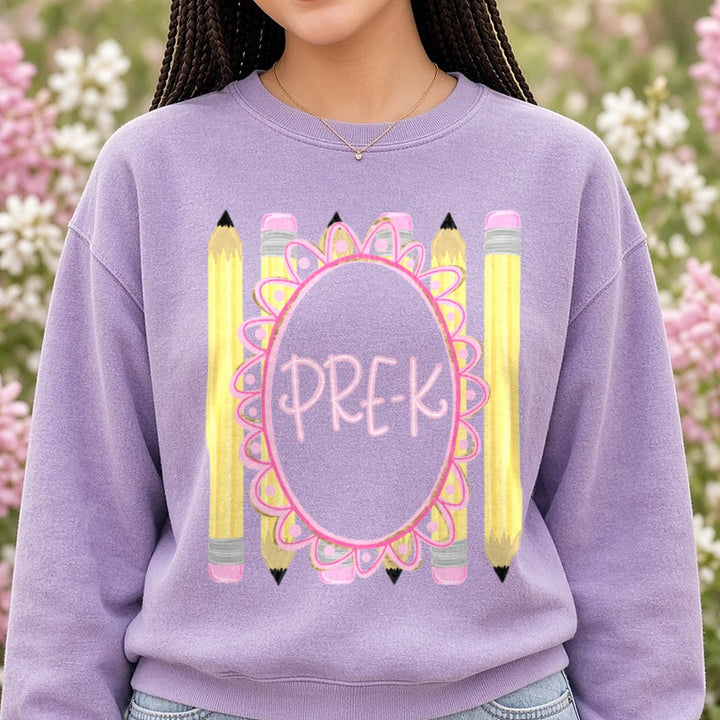 Pre-K Pink Gold Floral Oval Frame with Yellow Pencils DTF transfer shown on a Comfort Colors sweatshirt