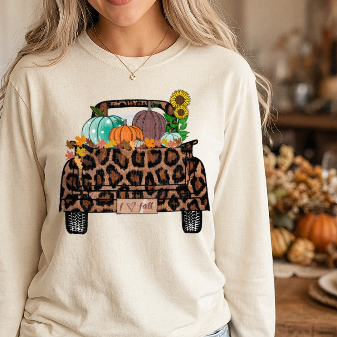Leopard Truck Pumpkins Sunflowers I Love Fall DTF transfer shown on a Comfort Colors long sleeve tee
