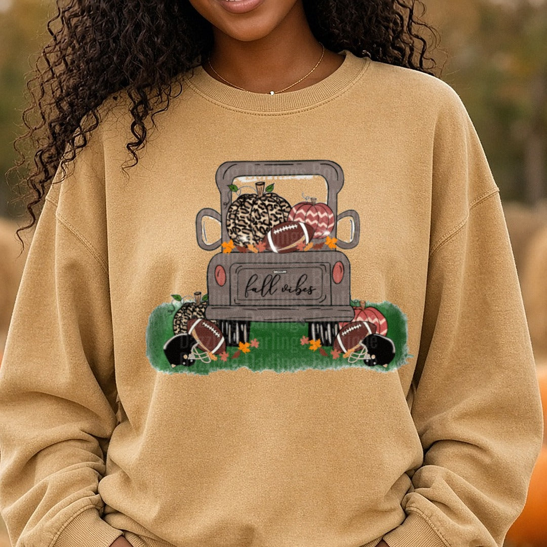 Fall Vibes Brown Truck Pumpkins Football DTF transfer shown on a Comfort Colors sweatshirt
