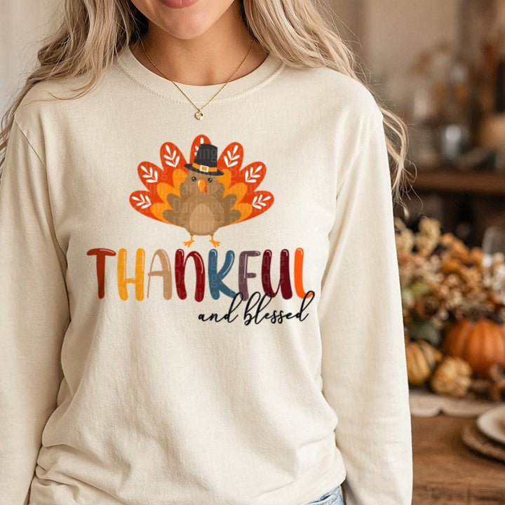 Thankful And Blessed Turkey Pilgrim Hat DTF transfer shown on a Comfort Colors long sleeve tee