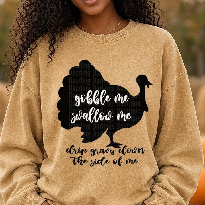 Gobble Me Swallow Me Turkey Silhouette Funny Thanksgiving DTF transfer shown on a Comfort Colors sweatshirt