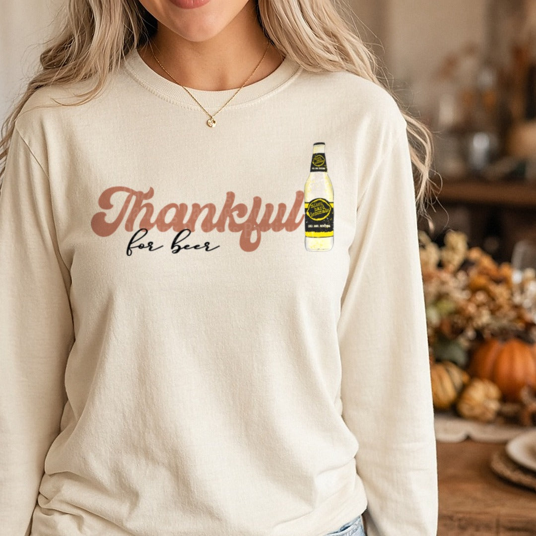 Thankful For Beer Gold Label Bottle Thanksgiving DTF transfer shown on a Comfort Colors long sleeve tee