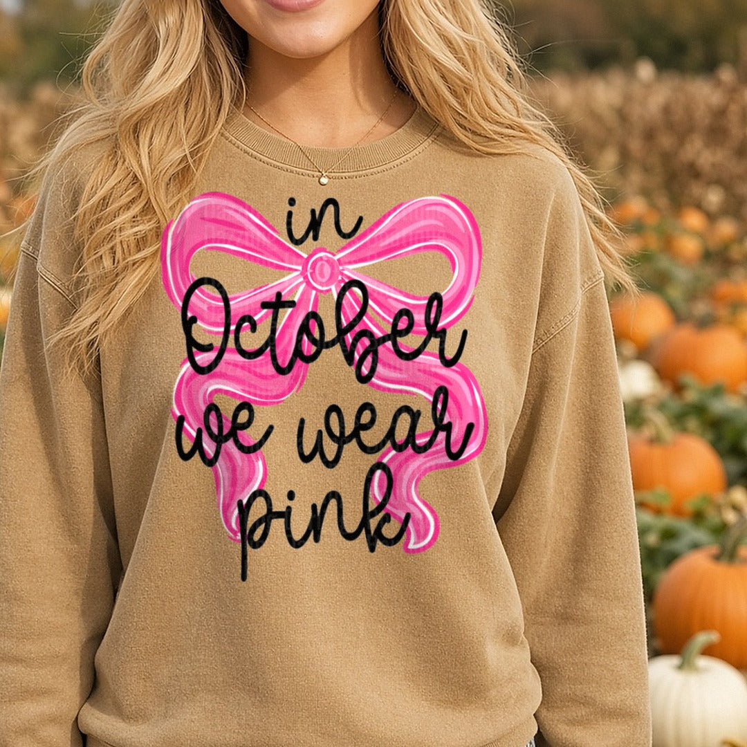 october-we-wear-pink-bow DTF transfer shown on a Comfort Colors sweatshirt