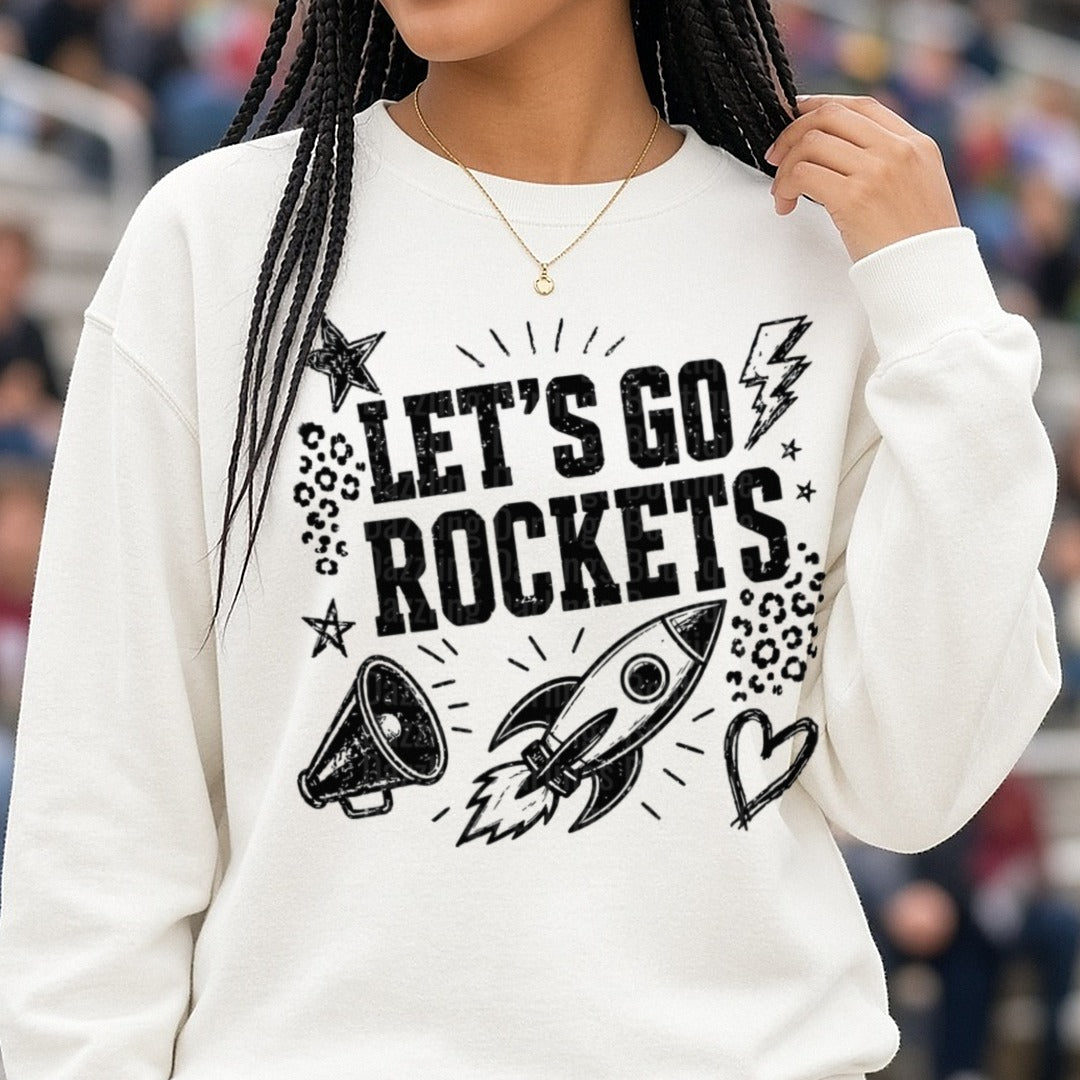 Let's Go Rockets Grunge Spirit Design with Rocket and Megaphone DTF transfer shown on a Comfort Colors sweatshirt