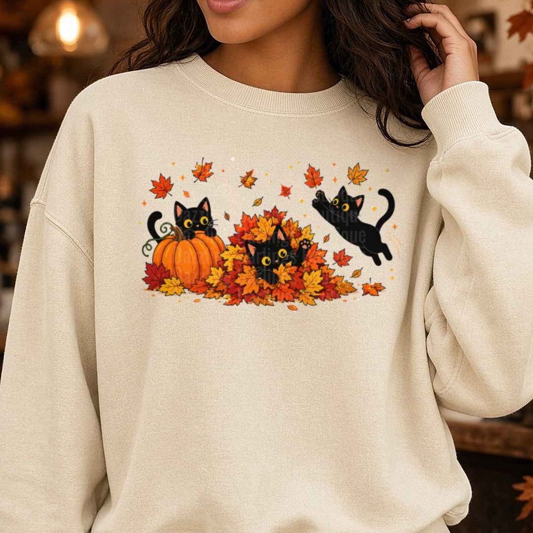 Black Cats Playing in Leaves DTF transfer shown on a Comfort Colors sweatshirt