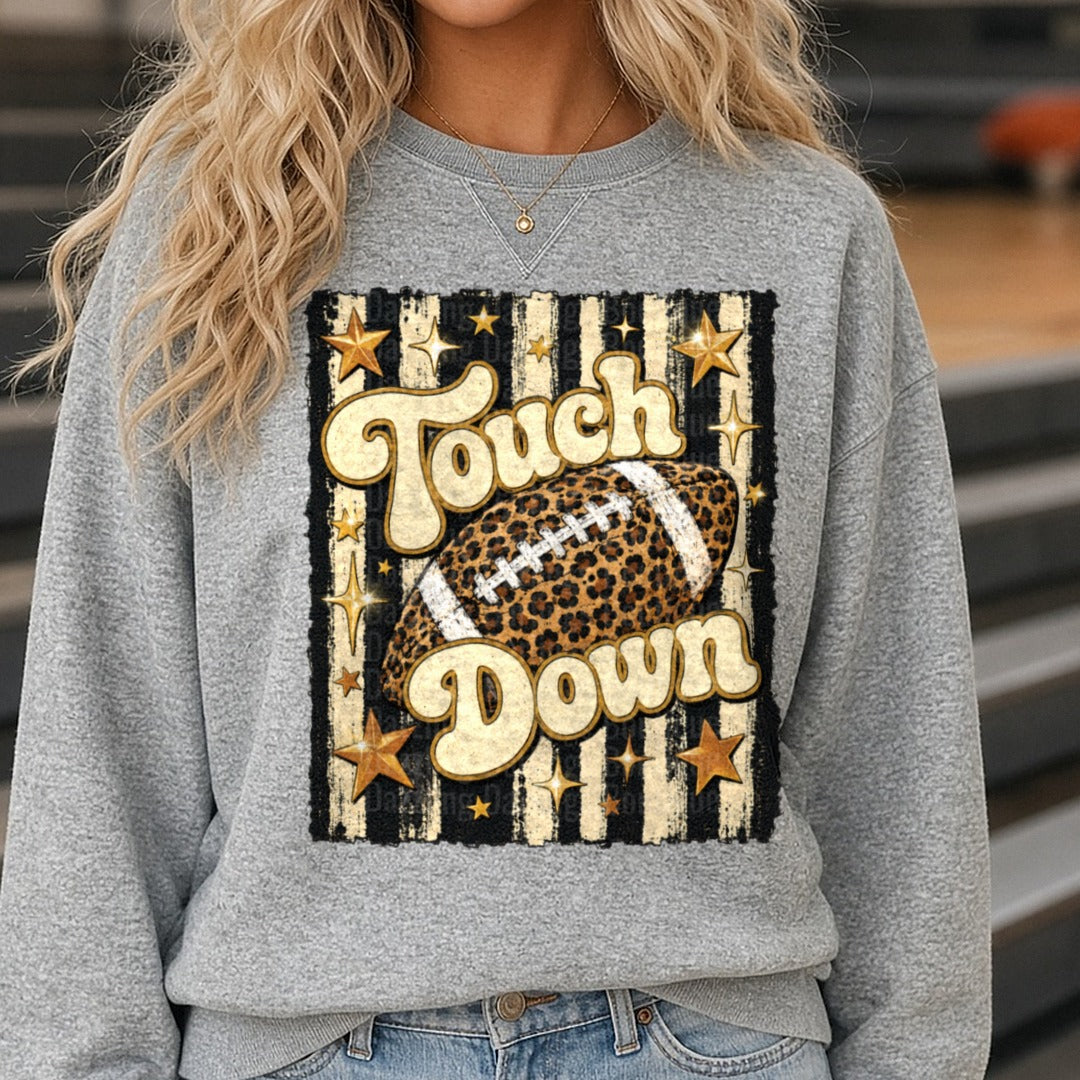 Striped Touchdown Leopard Football DTF transfer shown on a Comfort Colors sweatshirt
