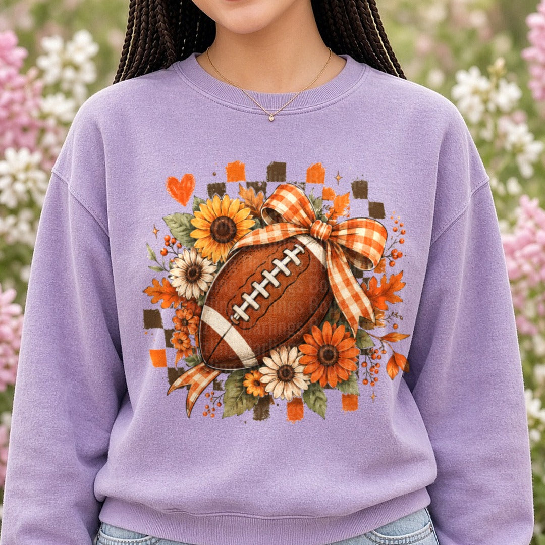 Checkered Flowers and Football DTF transfer shown on a Comfort Colors sweatshirt