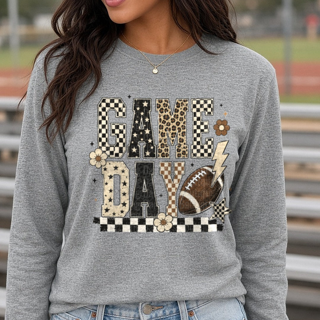 Game Day Black Cream Leopard Checkered Letters Lightning DTF transfer shown on a Comfort Colors long sleeve tee