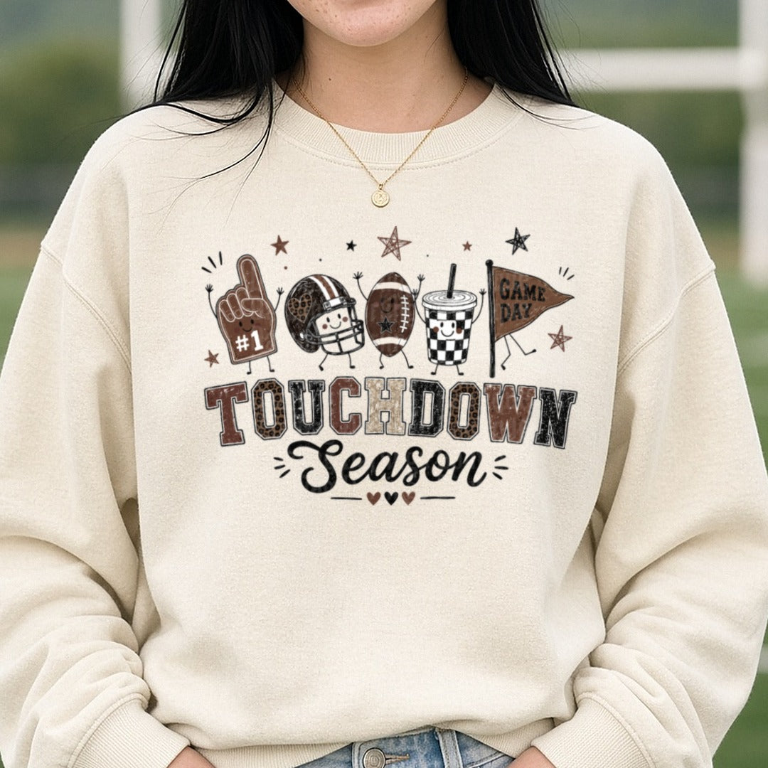 Touchdown Season Football Characters Foam Finger Pennant DTF transfer shown on a Comfort Colors sweatshirt