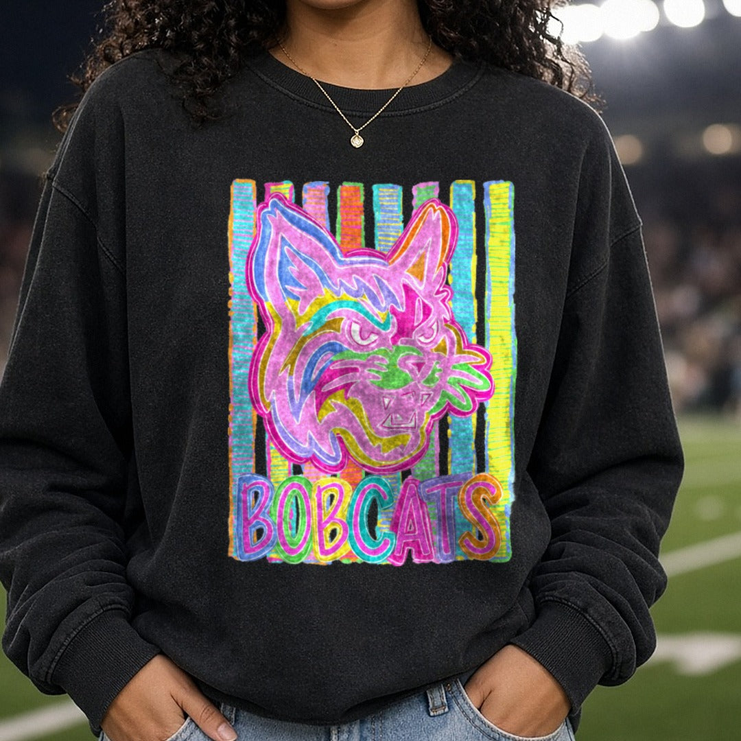 Neon Rainbow Bobcats Fierce Mascot Head Colorful Stripes DTF transfer shown on a Comfort Colors sweatshirt