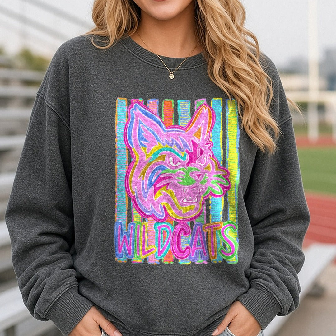 Wildcats Mascot Neon Rainbow Marker Art Bold Stripes DTF transfer shown on a Comfort Colors sweatshirt
