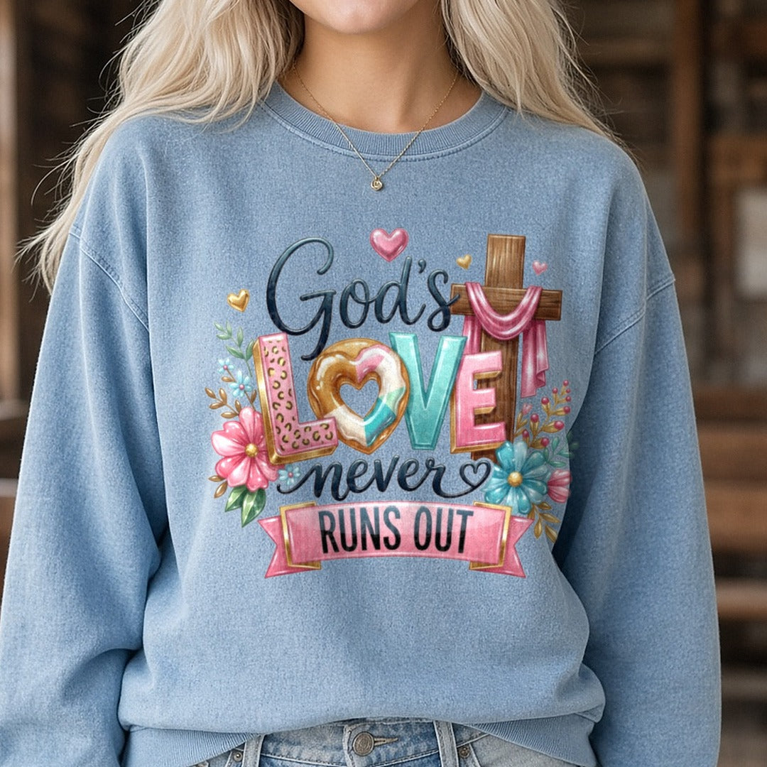 God's Love Never Runs Out DTF transfer shown on a Comfort Colors sweatshirt