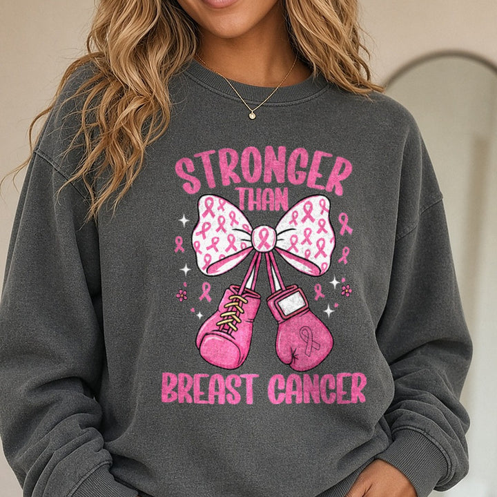 Stronger Than Breast Cancer Gloves DTF transfer shown on a Comfort Colors sweatshirt