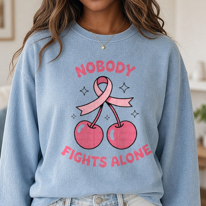 Nobody Fights Alone Cherry DTF transfer shown on a Comfort Colors sweatshirt