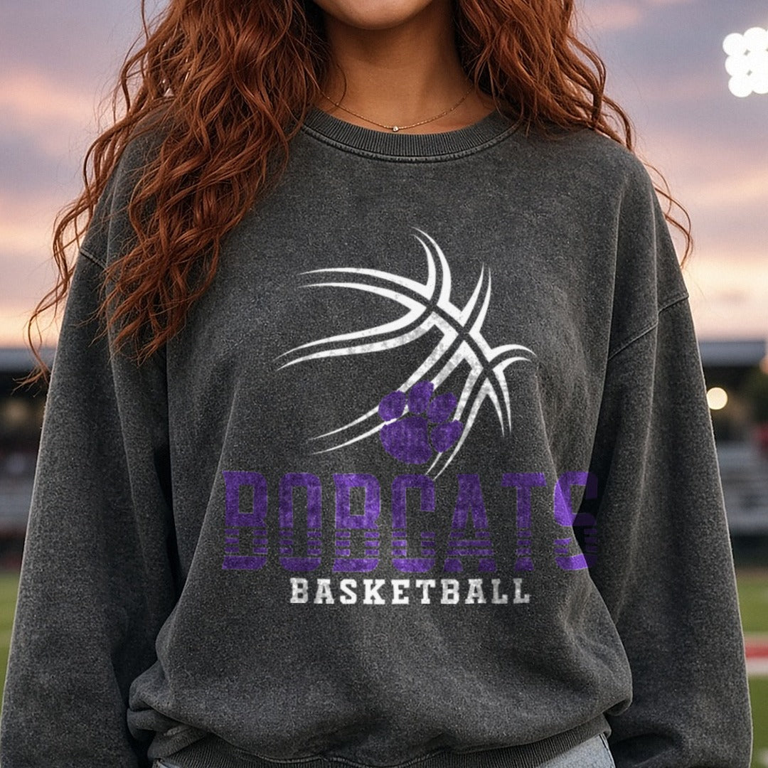 Purple Bobcats Paw Print Bold Striped Lettering DTF transfer shown on a Comfort Colors sweatshirt