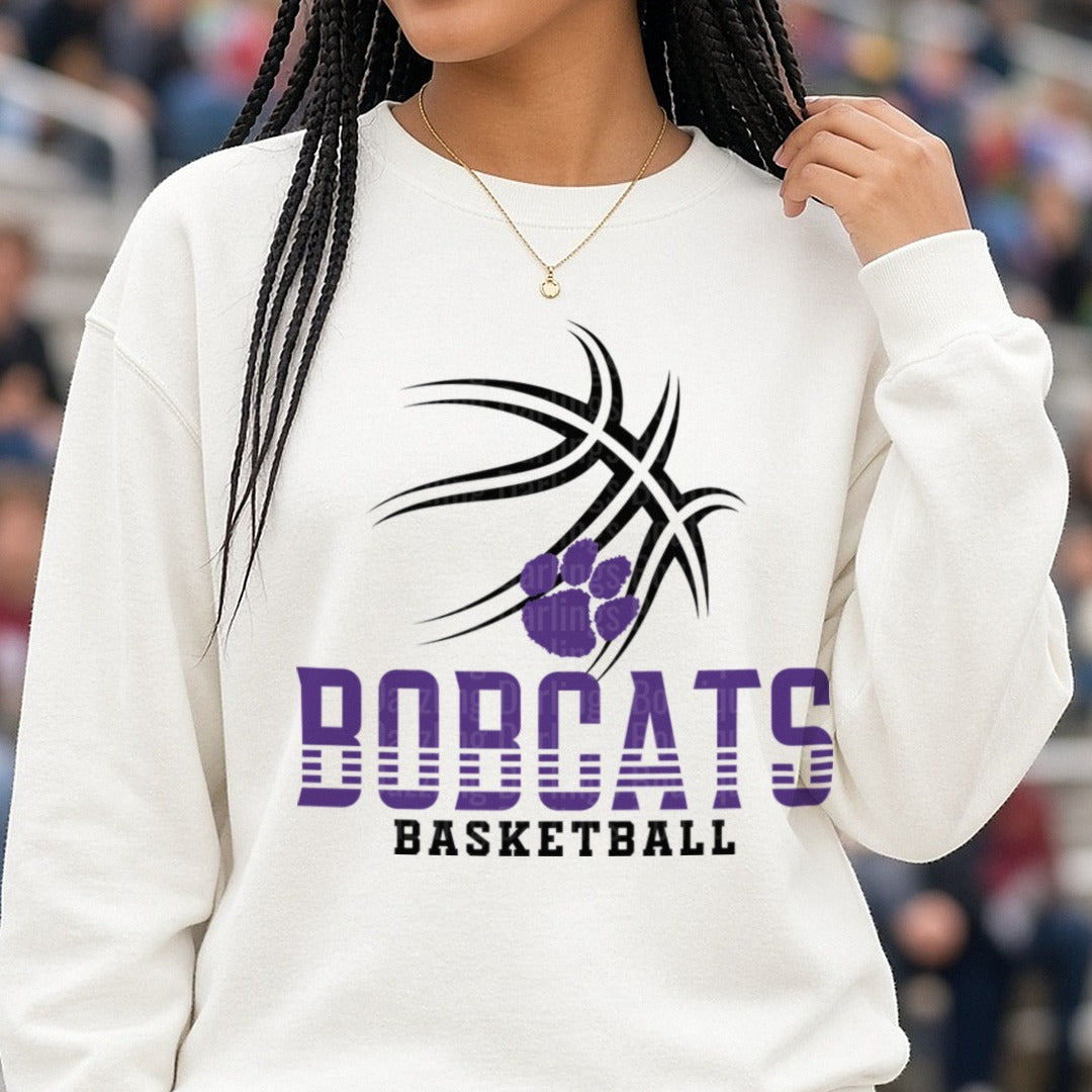 Bobcats Basketball Purple Paw Print Tribal Ball Logo DTF transfer shown on a Comfort Colors sweatshirt