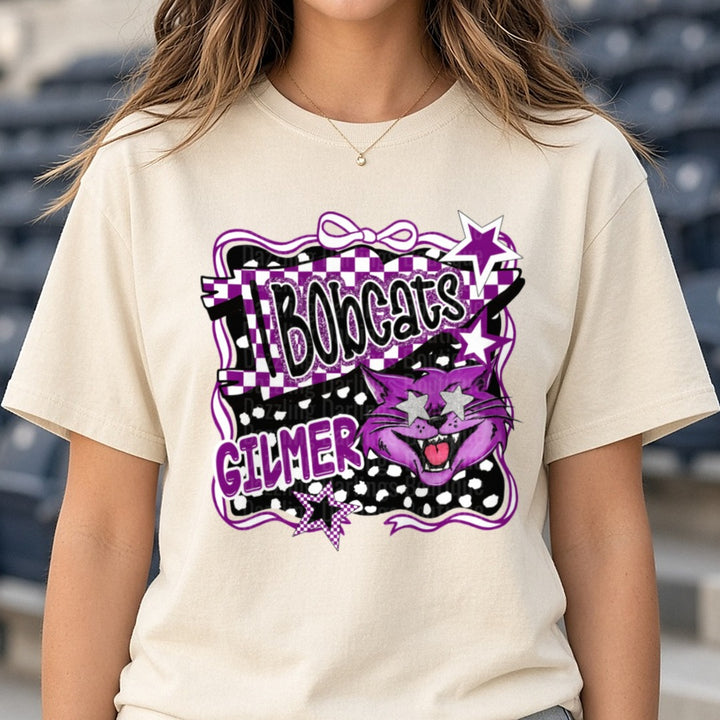 Gilmer Bobcats Purple Mascot Checkered Glitter Star Design DTF transfer shown on a Comfort Colors tee