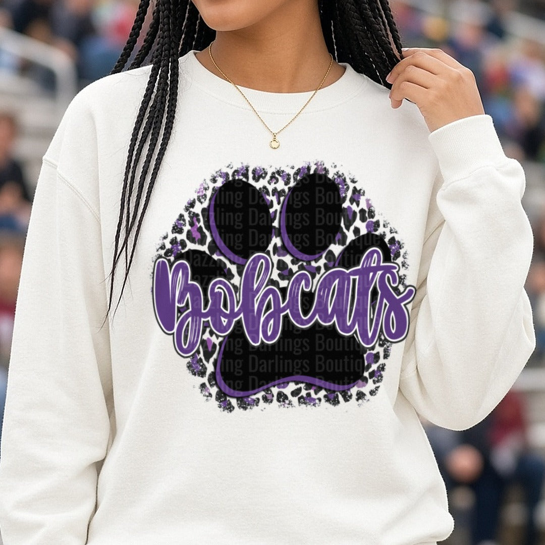 Bobcats Purple Script Paw Print Leopard Print Circle DTF transfer shown on a Comfort Colors sweatshirt