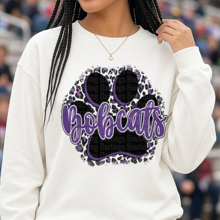 Bobcats Purple Script Paw Print Leopard Print Circle DTF transfer shown on a Comfort Colors sweatshirt