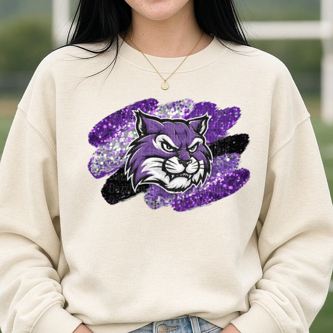 Purple Wildcat Mascot Glitter Brush Stroke DTF transfer shown on a Comfort Colors sweatshirt