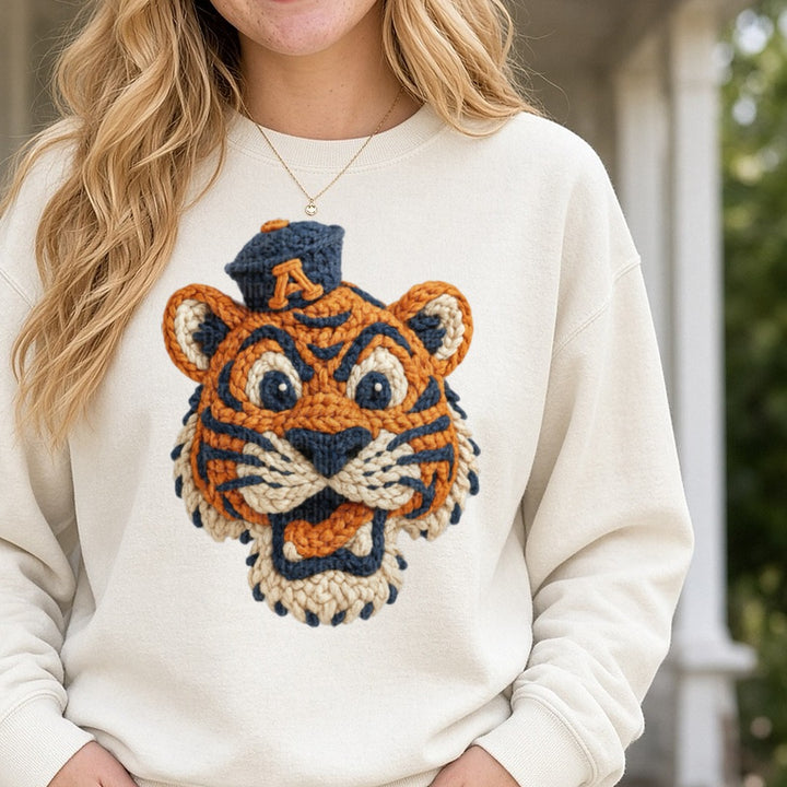Aubie Tiger Mascot Crochet Knit Style Portrait Navy Orange DTF transfer shown on a Comfort Colors sweatshirt
