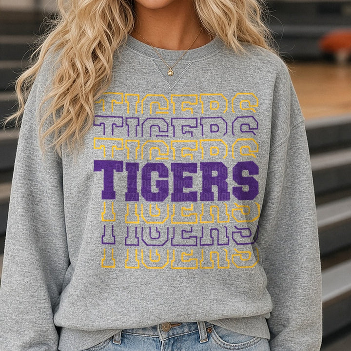 Tigers Purple and Gold Repeating Collegiate Word Pattern DTF transfer shown on a Comfort Colors sweatshirt