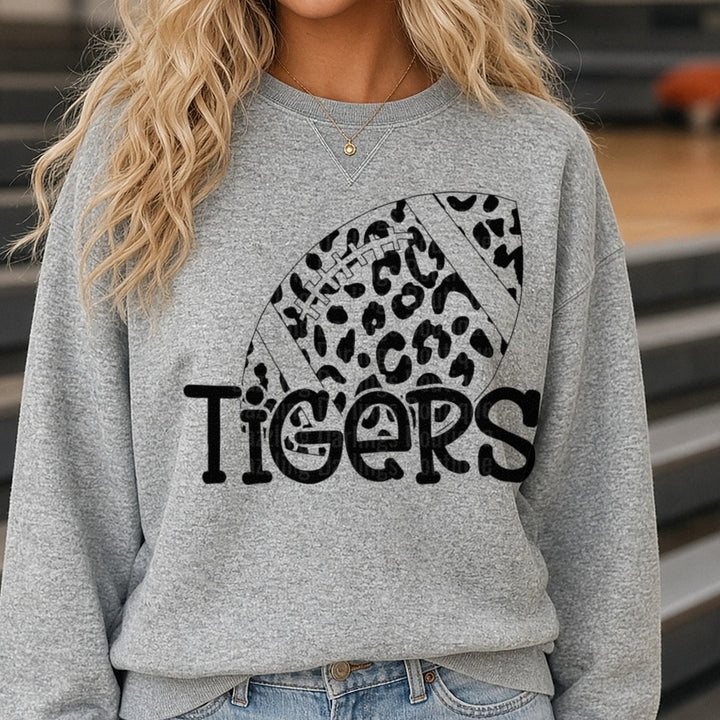 Tigers Leopard Print Football Graphic DTF transfer shown on a Comfort Colors sweatshirt