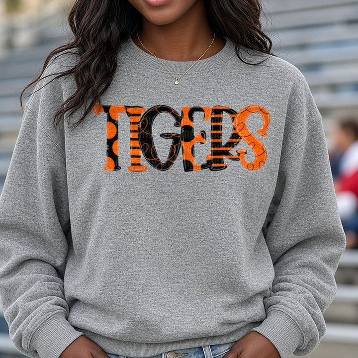Tigers Bold Patterned Orange Black Stripe Polka Dot Letters DTF transfer shown on a Comfort Colors sweatshirt