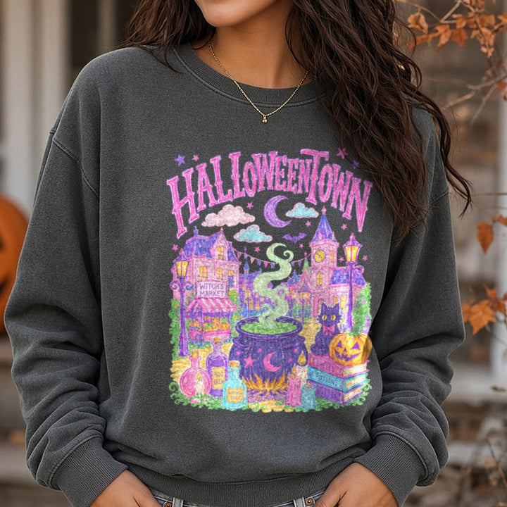 Halloweentown Pastel Witch's Market Cauldron Scene DTF transfer shown on a Comfort Colors sweatshirt