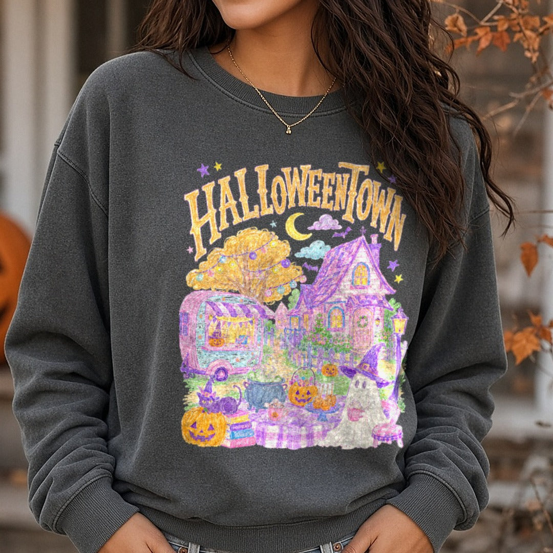Halloweentown Pastel Whimsical Scene with Ghost and Pumpkins DTF transfer shown on a Comfort Colors sweatshirt