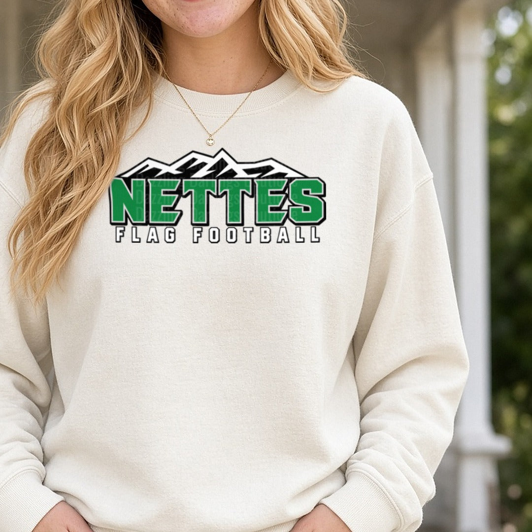 Nettes Flag Football Mountain Logo Green Bold Lettering DTF transfer shown on a Comfort Colors sweatshirt