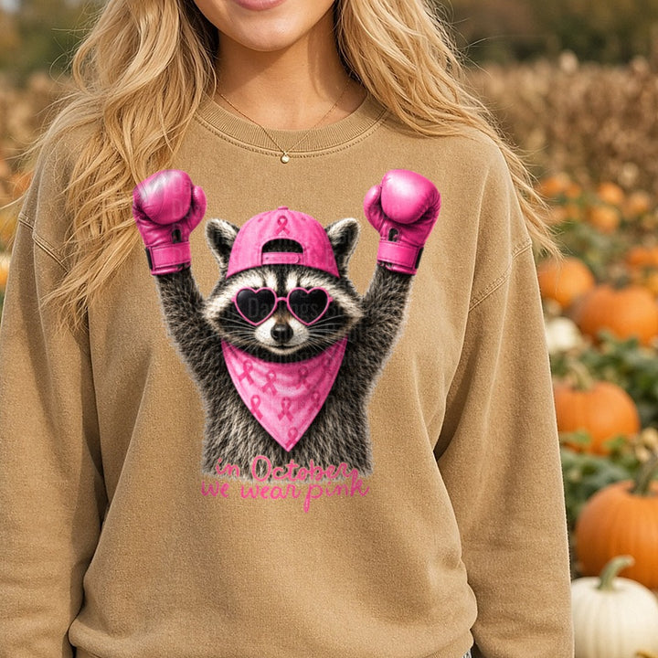Raccoon Boxing Gloves Pink Ribbon In October We Wear Pink DTF transfer shown on a Comfort Colors sweatshirt
