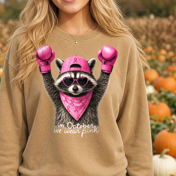 Raccoon Pink Boxing Gloves Breast Cancer Awareness in October DTF transfer shown on a Comfort Colors sweatshirt