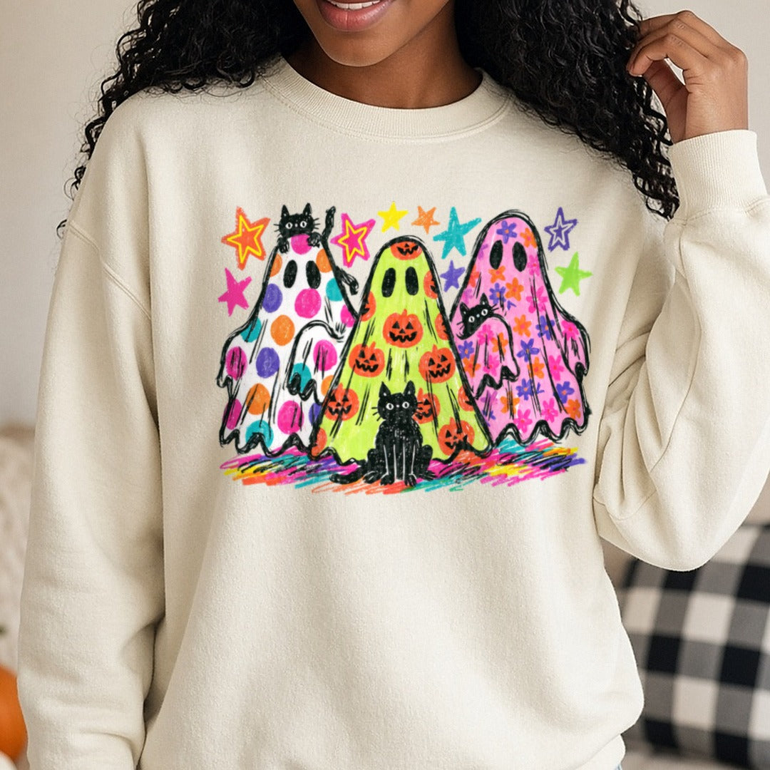 Retro Halloween Ghosts Black Cats Colorful Stars Crayon Art DTF transfer shown on a Comfort Colors sweatshirt