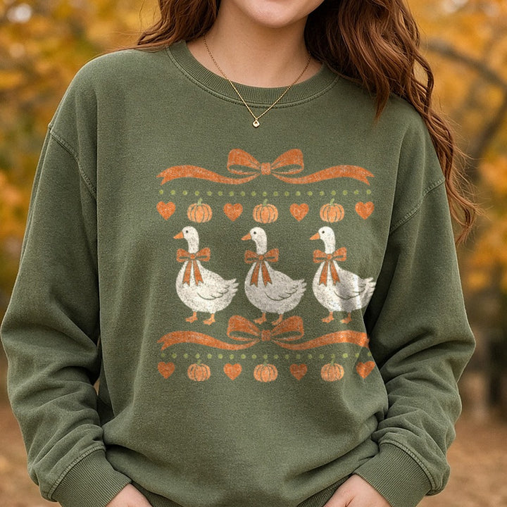 Fall Harvest Geese with Bows Pumpkins Hearts Banner DTF transfer shown on a Comfort Colors sweatshirt