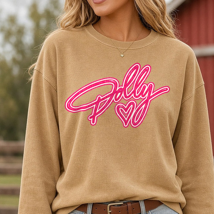 Dolly Glitter Script with Heart Pink Neon Cursive Logo DTF transfer shown on a Comfort Colors sweatshirt