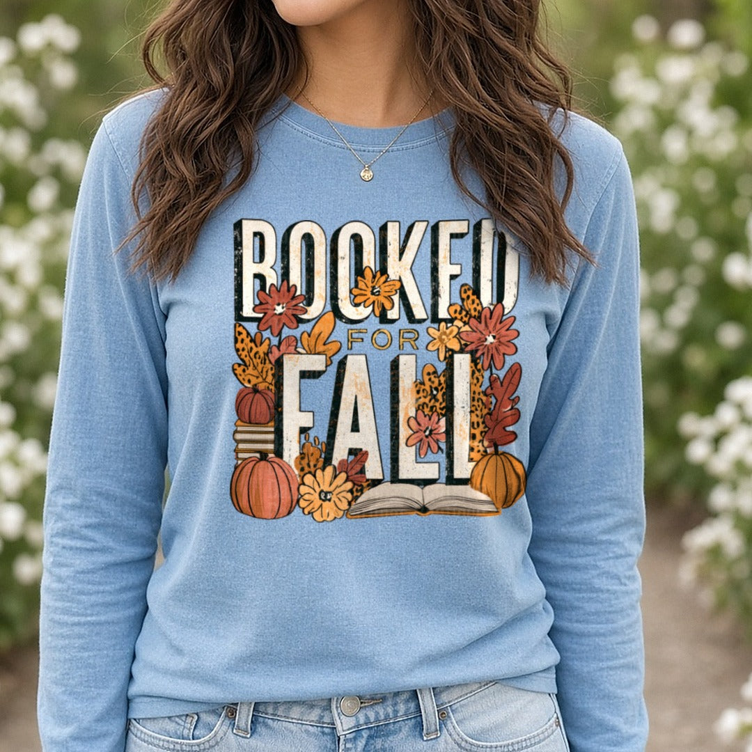 Booked For Fall Leopard Print Pumpkins Flowers Books Reading DTF transfer shown on a Comfort Colors long sleeve tee