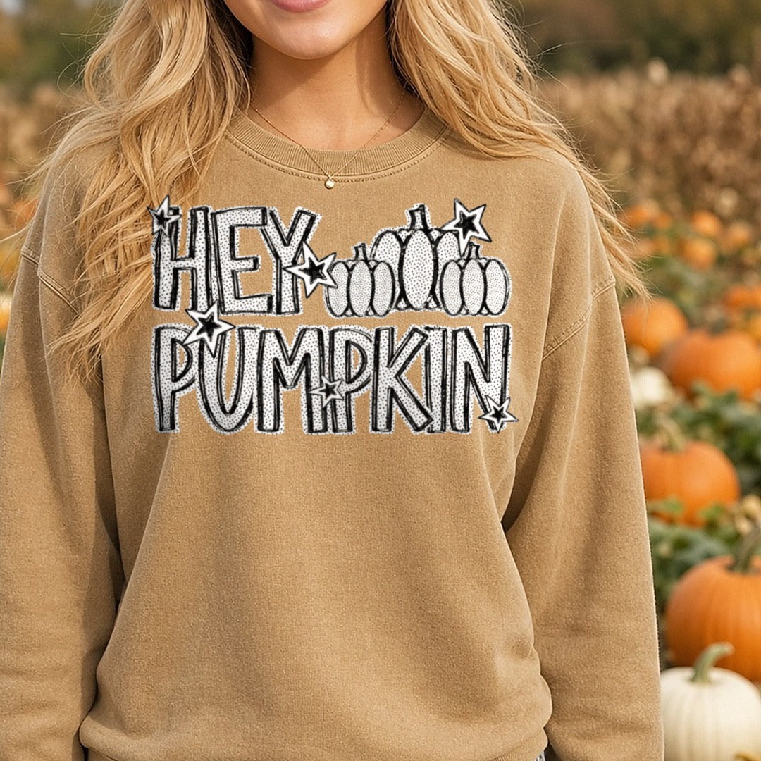Hey Pumpkin Bold Text with Stars and Pumpkins Fall Design DTF transfer shown on a Comfort Colors sweatshirt
