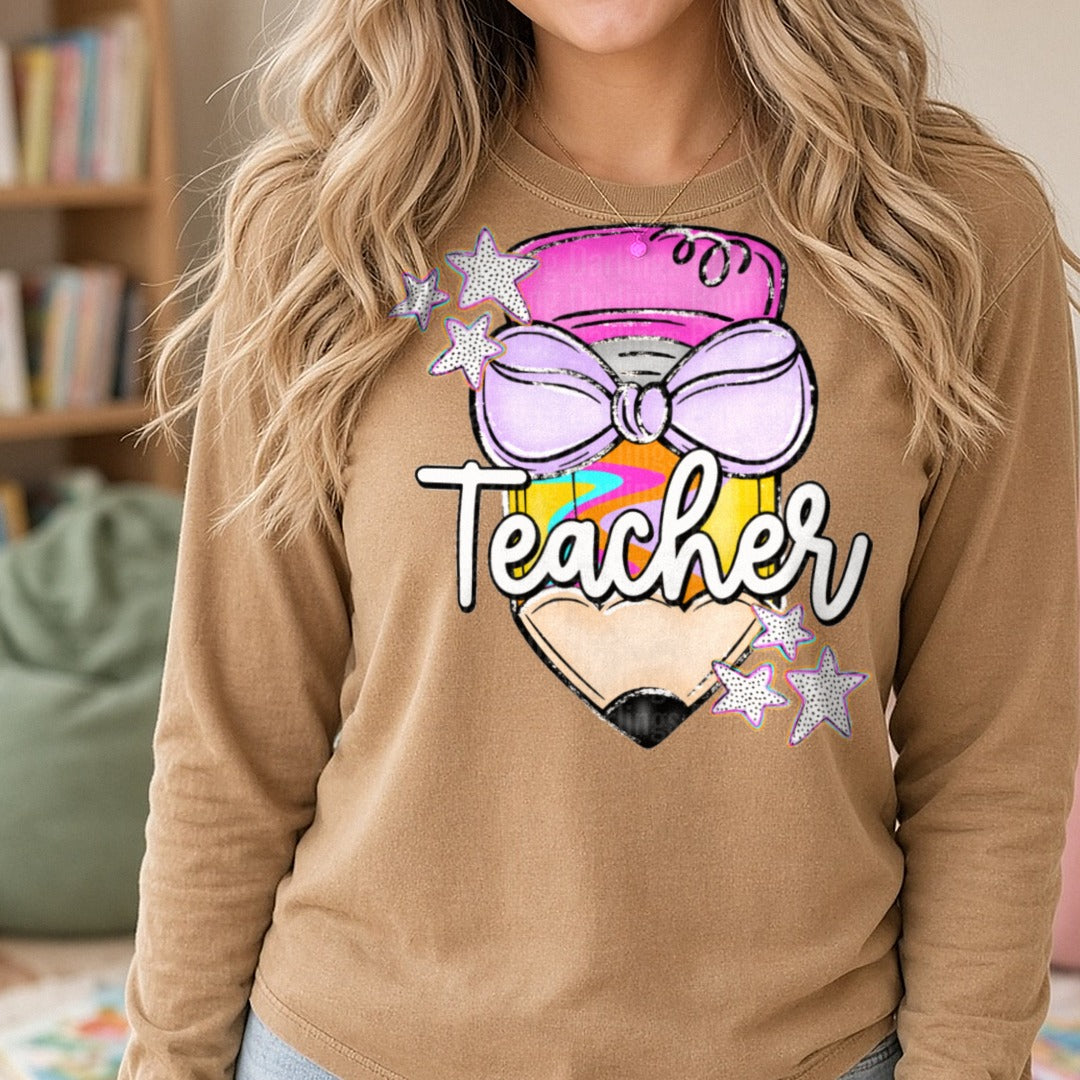 Cute Teacher Pencil with Purple Bow Pink Eraser and Stars DTF transfer shown on a Comfort Colors long sleeve tee