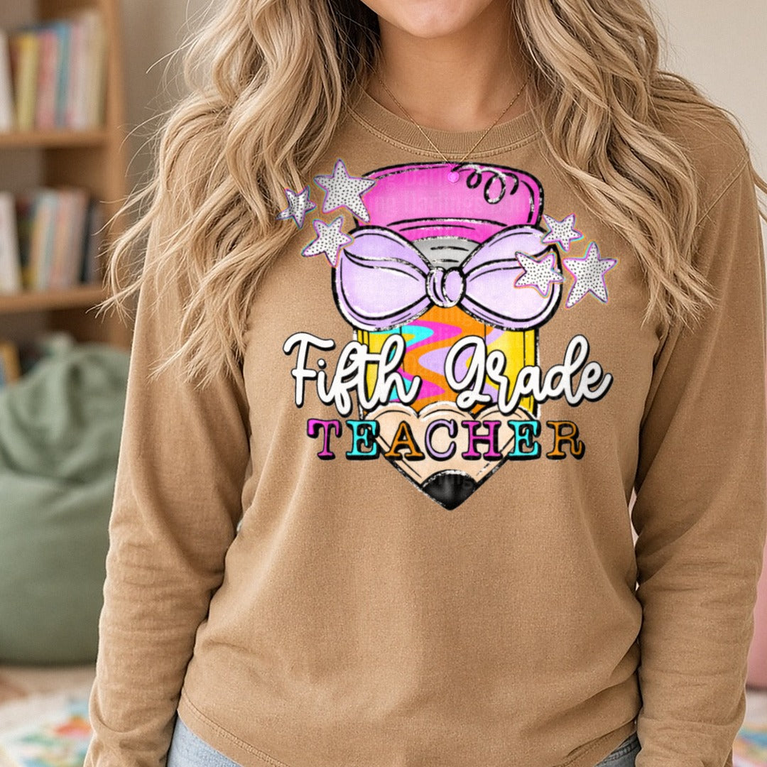 Fifth Grade Teacher Pencil with Bow and Stars DTF transfer shown on a Comfort Colors long sleeve tee