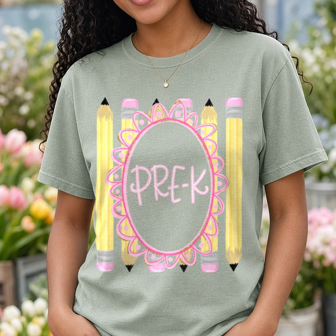 Pre-K Pink Floral Oval Frame with Yellow Pencils DTF transfer shown on a Comfort Colors tee