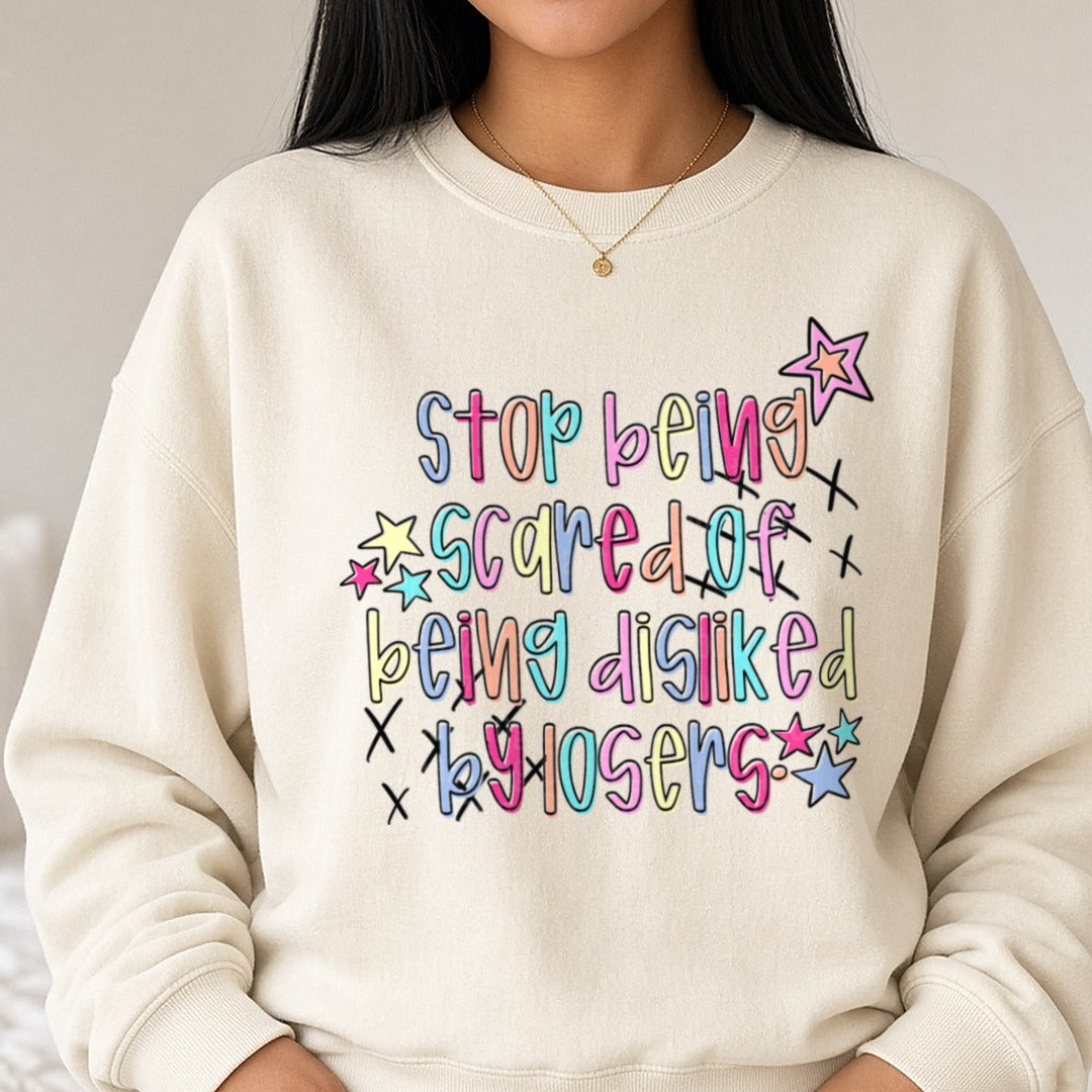 Stop Being Scared Of Being Disliked By Losers Colorful Stars DTF transfer shown on a Comfort Colors sweatshirt