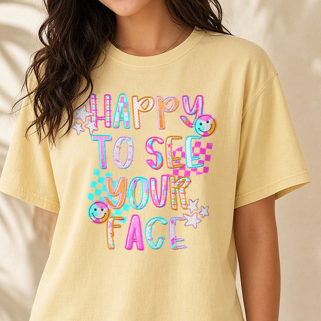 Happy To See Your Face Colorful Retro Smiley Face Design DTF transfer shown on a Comfort Colors tee