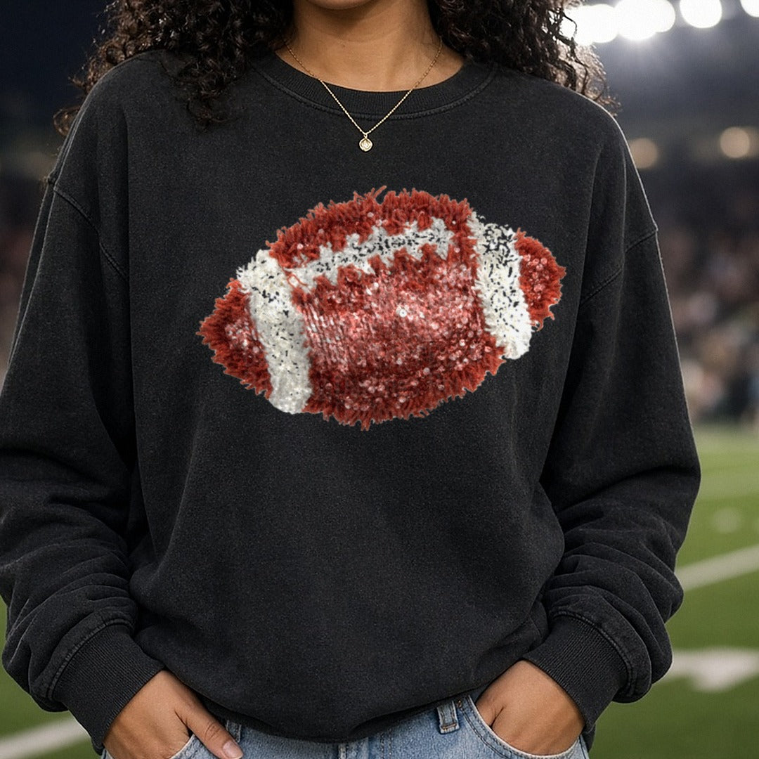 Sequin Glitter Football with Fringe Yarn Texture DTF transfer shown on a Comfort Colors sweatshirt