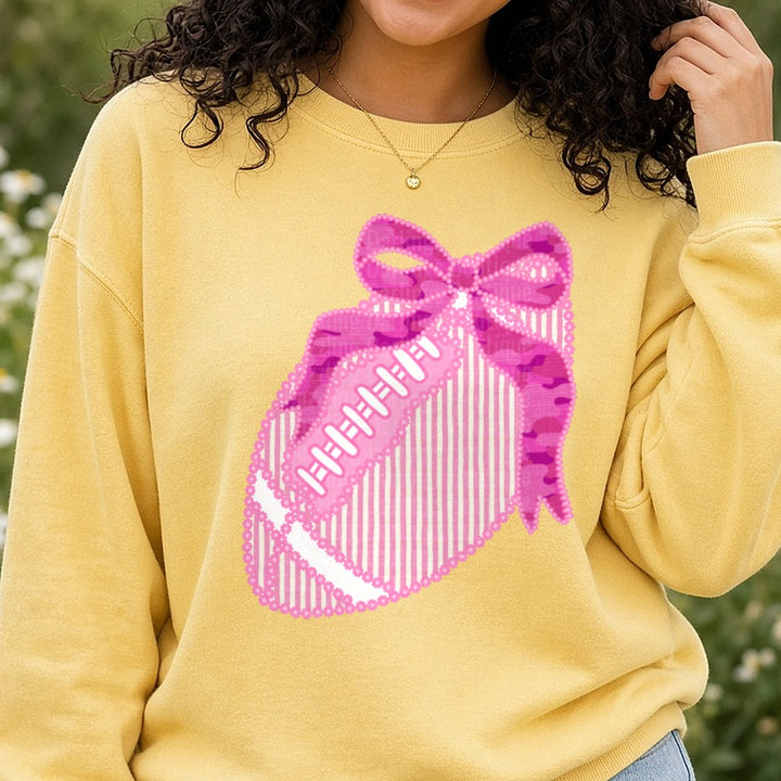 Pink Camo Football with Bow Floral Lace Border DTF transfer shown on a Comfort Colors sweatshirt