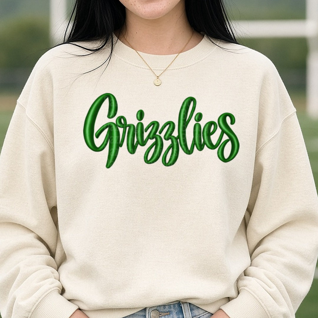 Grizzlies Green Script Embroidery Style Lettering DTF transfer shown on a Comfort Colors sweatshirt