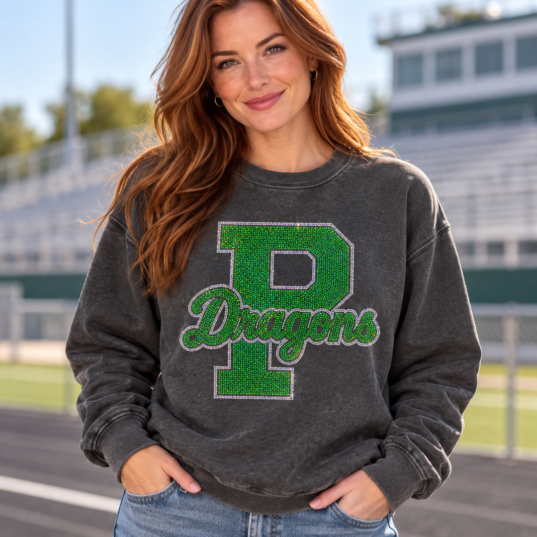 Mockup of green spangle bling block P with "Dragons" script transfer on a charcoal sweatshirt